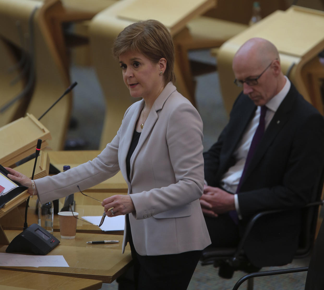 EDINBURGH, SCOTLAND - JUNE 17:  John Swinney MSP Deputy First Minister and Education Secretary with Nicola Sturgeon MSP First Minister during Covid-19 social distancing First Ministers Questions at the Scottish Parliament Holyrood on June 17, 2020 in Edinburgh, Scotland. (Photo by Fraser Bremner - Pool/Getty Images)