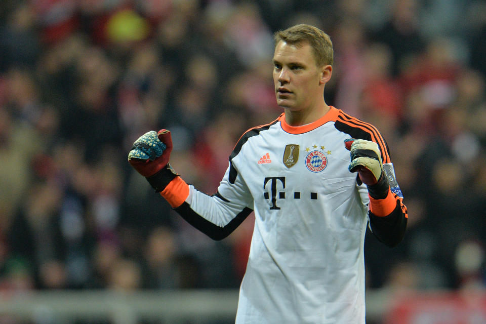 Bayern's goalkeeper Manuel Neuer celebrates after the Champions League round of the last 16 second leg soccer match between FC Bayern Munich and Arsenal FC in Munich, Germany, on Tuesday, March 11. 2014. The match finished 1:1. (AP Photo/Kerstin Joensson)