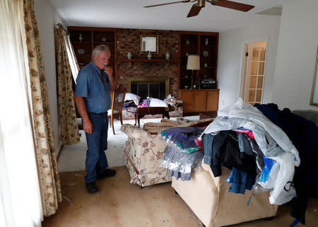 John Wayne Phillips stands in his living room after flooding due to Hurricane Florence receded in Fair Bluff, North Carolina, U.S. September 29, 2018. REUTERS/Randall Hill