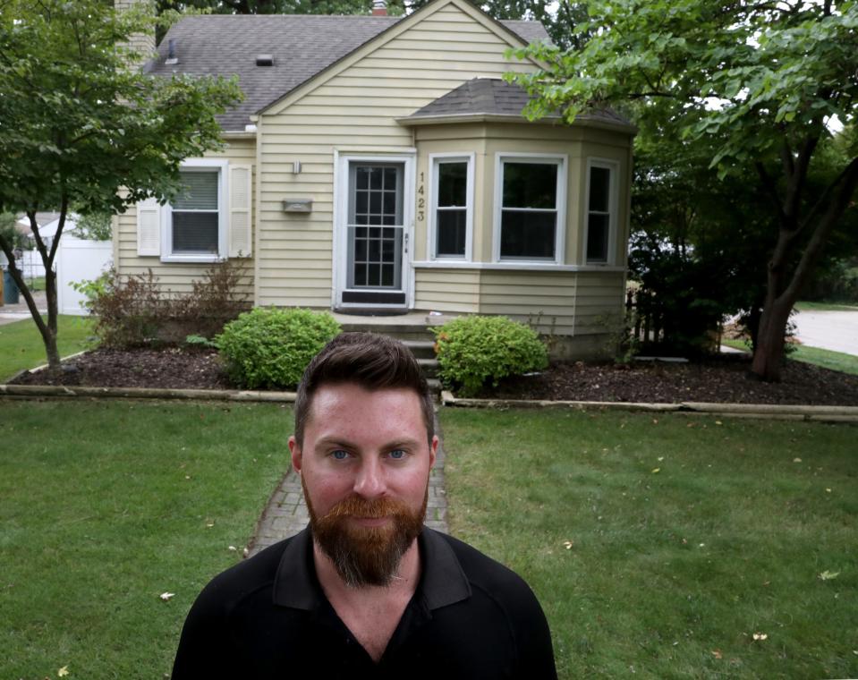 Chris Roberts, 34, in front of his old house on Oct. 1, 2019.
Roberts bought this home in 2012 and sold recently it after doing a quick all-cash deal with a real estate agent who bought this home. 
He thinks he could have received $20,000 more had he tried to sell this house through a regular listing but the selling approach the agent had Roberts felt it reduced the hassle factor for him.