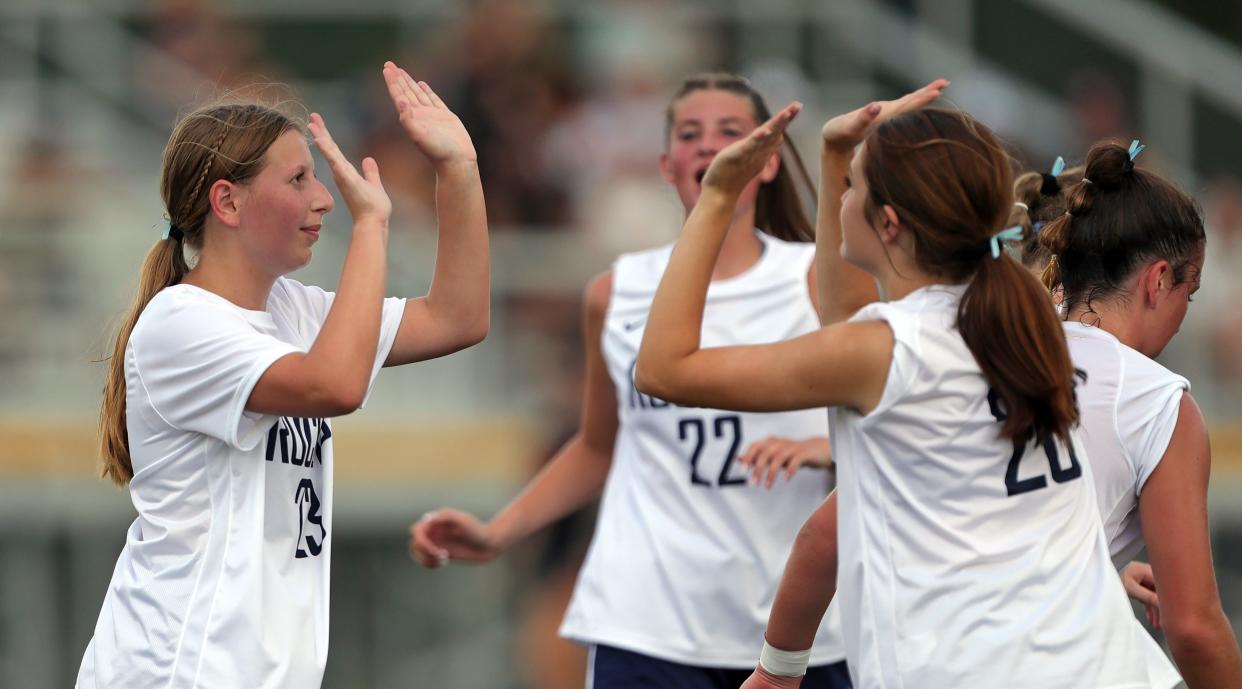 Streetsboro's Lydia Schofield, left, celebrates her goal with teammates during the first half of a high school soccer game, Friday, Aug. 16, 2024, in Mantua, Ohio.