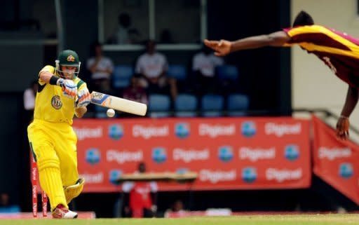 Australian cricketer Mike Hussey plays a shot during the fifth-of-five one-day international (ODI) between West Indies and Australia at the Beausejour Cricket Ground in Gros Islet, St Lucia, March 25. Australia defeated West Indies by 30 runs on Sunday to win the fifth and final one-day international and level the series at 2-2