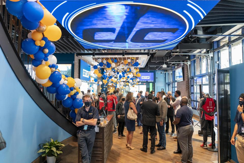 Guests mingle at a ribbon cutting ceremony at the William Hill Sportsbook at Monumental Sports & Entertainment's Capital One Arena in Washington, Wednesday, May 26, 2021. The first full-service sportsbook at a major four North American pro sports venue in the United States opens its doors. (AP Photo/Andrew Harnik)