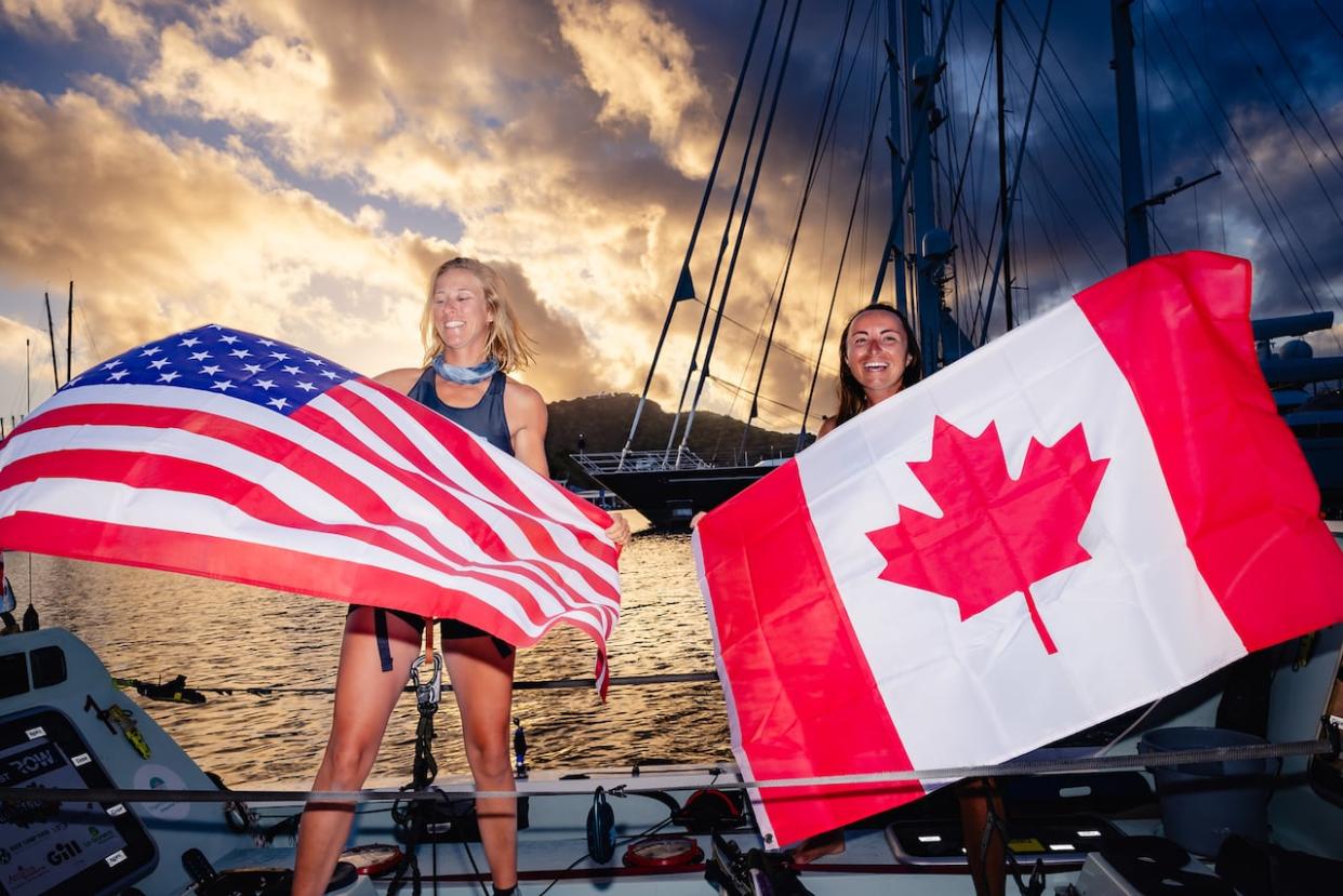 Rowers Lauren Champion, left, and Lisa Roland completed the Atlantic crossing in a little over 45 days. (World’s Toughest Row - image credit)