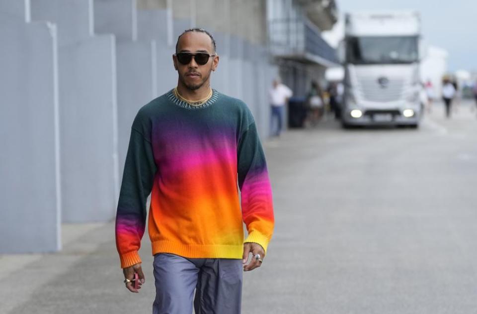 Mercedes driver Lewis Hamilton of Britain arrives prior to the third free practice session for the Hungarian Formula One Grand Prix at the Hungaroring racetrack in Mogyorod, near Budapest, Hungary, Saturday, July 30, 2022. (AP Photo/Darko Bandic)