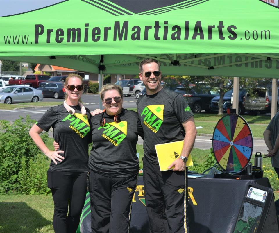 Manager Amanda Cole (left) and owners Andrea and Luke Myers are working to get the word out about their martial arts facility.