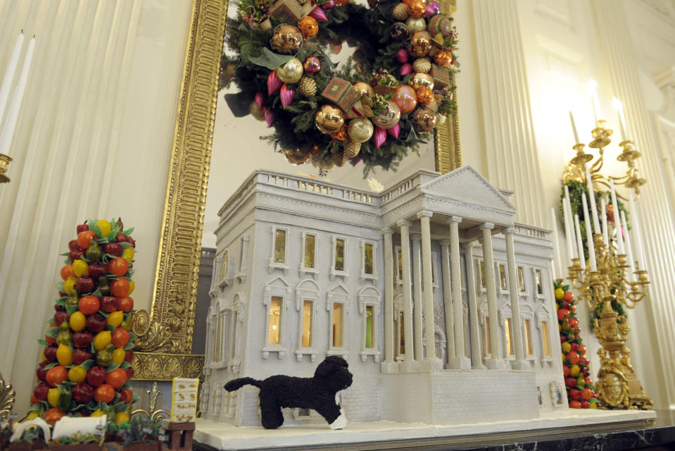 Bo, the Obama family pet, is replicated on the nearly 300-pound gingerbread house of the White House on display in the State Dining Room of the White House in Washington, Wednesday, Nov. 28, 2012. The theme for the White House Christmas 2012 is Joy to All. The White House gingerbread house has been a tradition since the 1960s. (AP Photo/Susan Walsh)