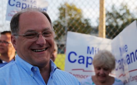 Incumbent U.S. Representative Mike Capuano speaks to reporters after voting in the Massachusetts Primary Election in Somerville - Credit: Reuters