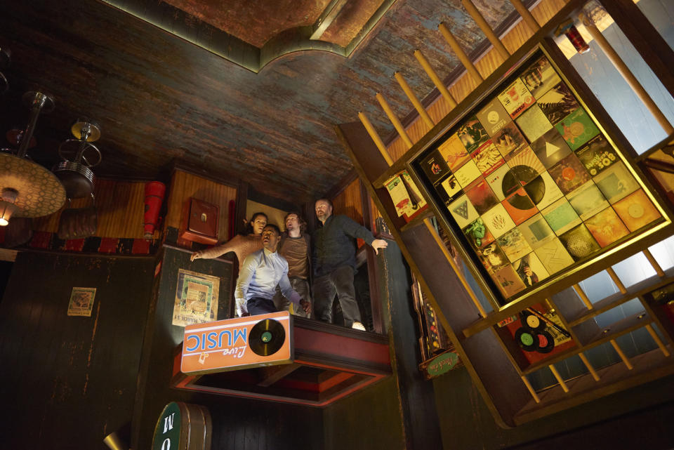 This image released by Sony Pictures shows Jay Ellis, clockwise from foreground center, Taylor Russell, Logan Miller and Tyler Labine in "Escape Room." (David Bloom/Sony Pictures via AP)