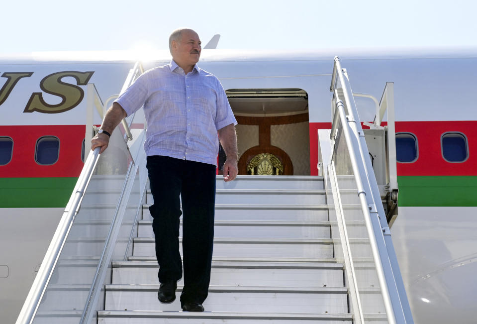 Belarusian President Alexander Lukashenko steps down from his plane upon his arriving at the Black Sea resort of Sochi, Russia, Monday, Sept. 14, 2020. Belarus' authoritarian president, Lukashenko is visiting Sochi for talks with Russian President Vladimir Putin a day after an estimated 150,000 flooded the streets of the Belarusian capital, demanding Lukashenko's resignation. (Andrei Stasevich /BelTA Pool Photo via AP)