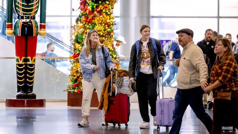 People walk through the Salt Lake City International Airport on Tuesday, Nov. 21, 2023. AAA estimates that 55.4 million travelers will head 50 miles or more from home over the Thanksgiving holiday period between Wednesday and Sunday, Nov. 26.