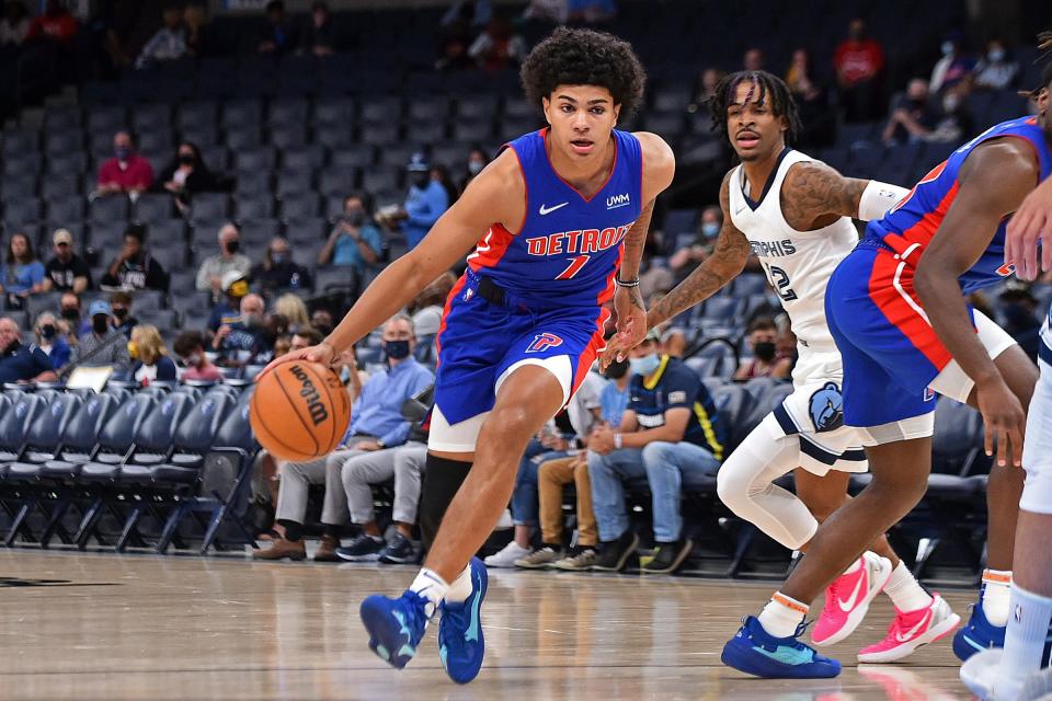 Pistons guard Killian Hayes drives to the basket against Grizzlies guard Ja Morant in the first half of the preseason game on Monday, Oct. 11, 2021, in Memphis, Tennessee.