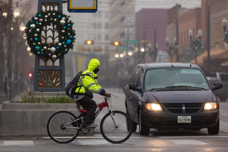 El Pasoans make their way downtown through a layer of dense fog on Dec. 21. An advisory remains in effect until 10 a.m.