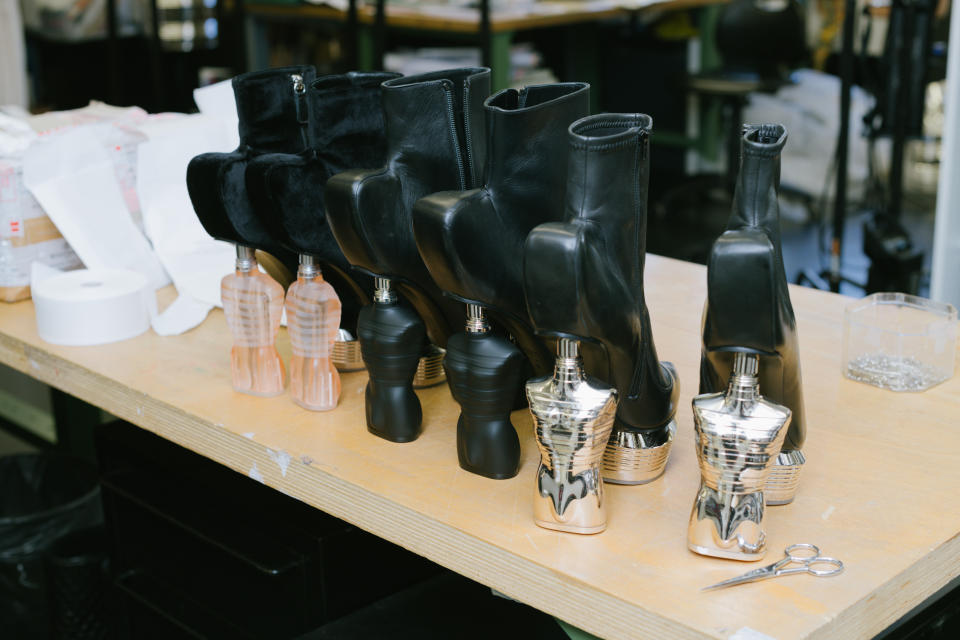 Olivier Rousteing incorporated Jean Paul Gaultier fragrance bottles into the collection – here as shoe heels. - Credit: Vanni Bassetti