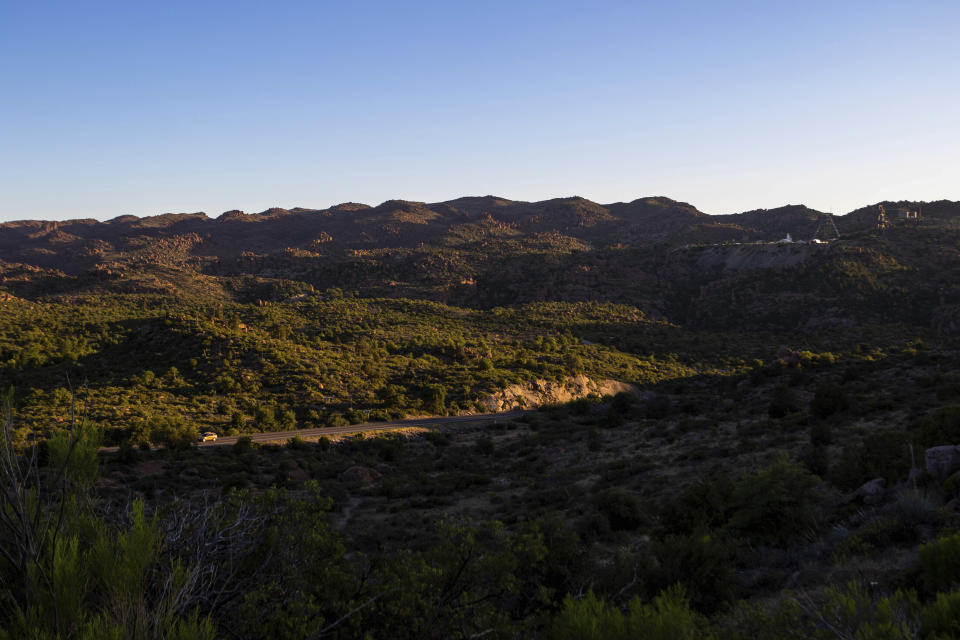 The sun sets over Oak Flat Campground, a sacred site for Native Americans located 70 miles east of Phoenix, on June 3, 2023, in Miami, Ariz. Oak Flat, or Chi’chil Bildagoteel, is a consecrated place used for prayer and ritual by many Native Americans in the region. Elders say the land was blessed by Usen, their Creator, and inhabited by Ga’an, the mountain spirits or angels who provide spiritual succor and guidance to seekers. (AP Photo/Ty O'Neil)