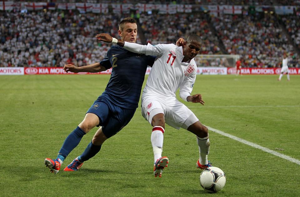 England's Ashley Young (right) and France's Mathieu Debuchy battle for the ball.