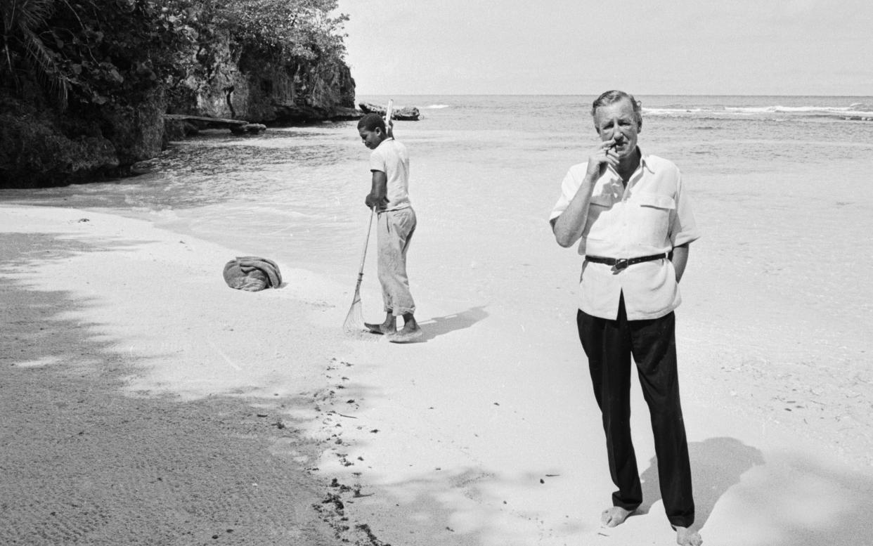 Ian Fleming on the beach near GoldenEye, Jamaica, in 1964 - getty