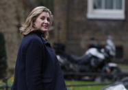 Penny Mordaunt Secretary of State for International Development looks back towards the media after attending a cabinet meeting at 10 Downing Street, in London Tuesday, Dec. 18, 2018. (AP Photo/Alastair Grant)