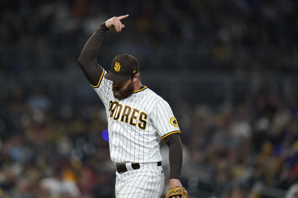 San Diego Padres relief pitcher Austin Adams reacts after getting the third out during the ninth inning of a baseball game against the Atlanta Braves, Friday, Sept. 24, 2021, in San Diego. (AP Photo/Gregory Bull)