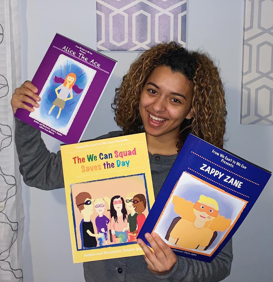 Trinity Jagdeo with the books she has written and illustrated to showcase superheroes with disabilities. (Courtesy Trinity Jagdeo)