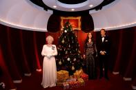 <p>If you think this is nothing more than a sweet portrait of Queen Elizabeth with Prince William and Kate Middleton, look closer. These are actually wax figures that were unveiled at Madame Tussauds Sydney just in time for Christmas. </p>
