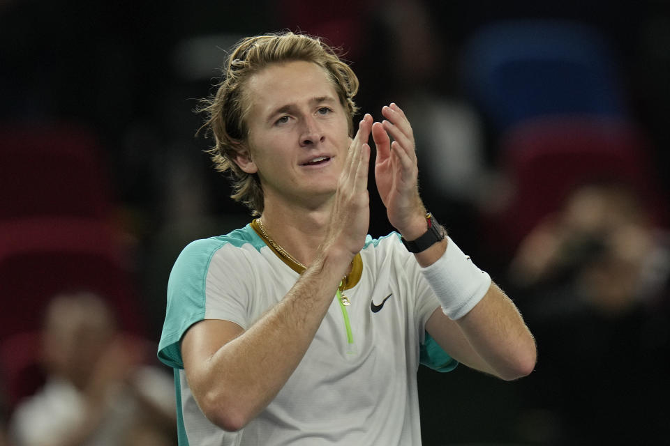 Sebastian Korda of the United States celebrates after defeating his compatriot Ben Shelton during the men's singles quarterfinal match in the Shanghai Masters tennis tournament at Qizhong Forest Sports City Tennis Center in Shanghai, China, Thursday, Oct. 12, 2023. (AP Photo/Andy Wong)