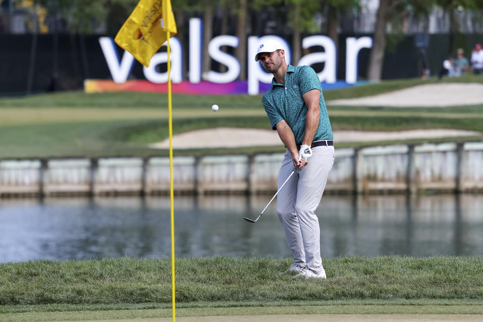 Wesley Bryan hits onto the 12th green during the second round of the Valspar Championship golf tournament Friday, March 17, 2023, at Innisbrook in Palm Harbor, Fla. (AP Photo/Mike Carlson)