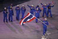 <p>Mark Chanloung carries the flag of Thailand during the opening ceremony of the 2018 Winter Olympics in Pyeongchang, South Korea, Friday, Feb. 9, 2018. (Sean Haffey/Pool Photo via AP) </p>