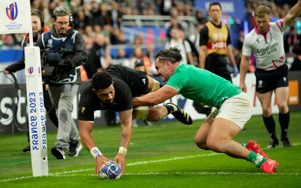 Ardie Savea scores a try despite Ireland's James Lowe in the Rugby World Cup quarter-final