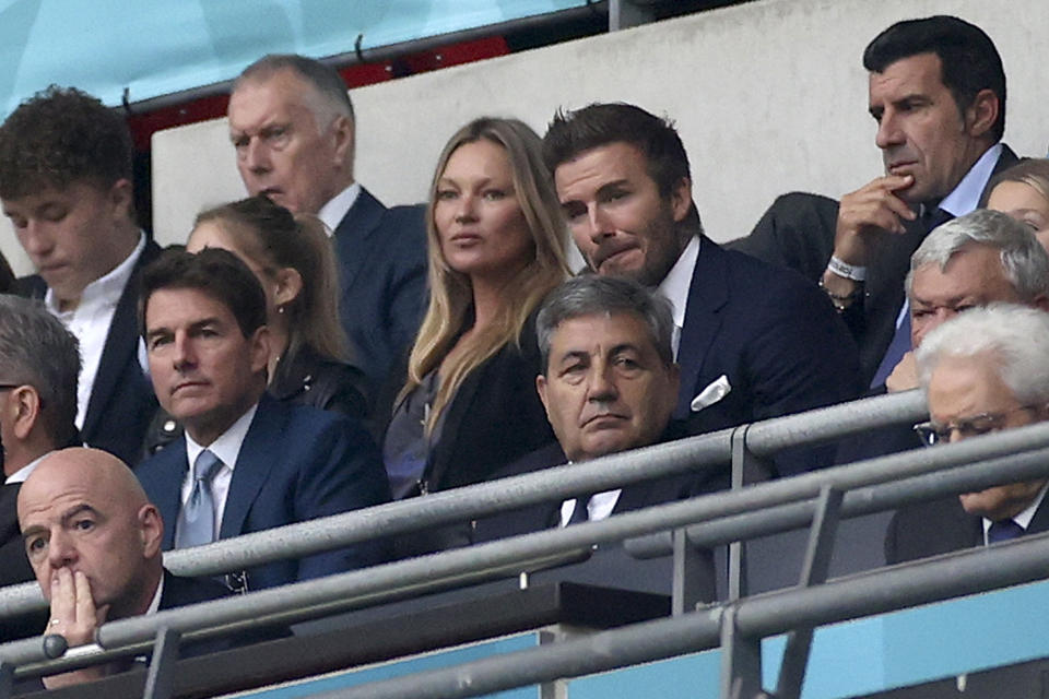 FIFA President Gianni Infantino, US actor Tom Cruise, Portuguese Soccer Federation President Fernando Gomes, former England player David Beckham and former Portugal player Luis Figo on the stands during the Euro 2020 soccer championship final match between England and Italy at Wembley stadium in London, Sunday, July 11, 2021. (Carl Recine/Pool Photo via AP)