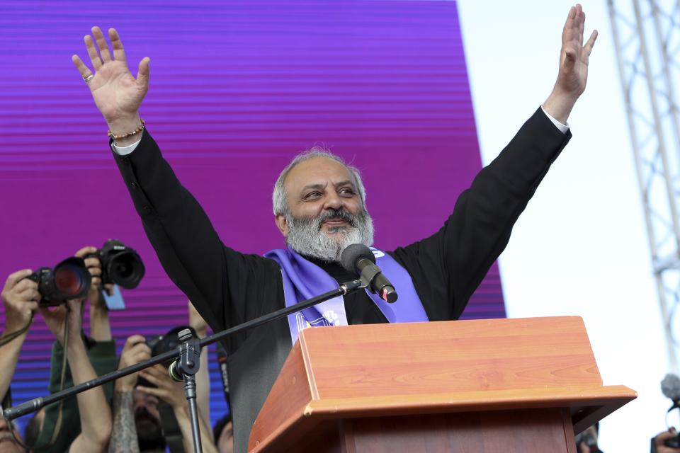 The Armenian Apostolic Church, archbishop of the Tavush diocese in Armenia's northeast Bagrat Galstanyan, gestures while addresses a crowd during a rally against Prime Minister Nikol Pashinyan in Yerevan, Armenia, Sunday, May 26, 2024. Tens of thousands of demonstrators have held a protest in the center of the capital of Armenia, calling for the resignation of Prime Minister Nikol Pashinyan after Armenia agreed to hand over control of several border villages to Azerbaijan. (Stepan Poghosyan/Photolure via AP)