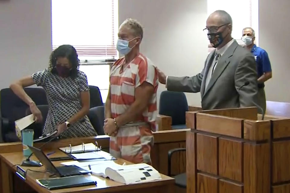 FILE - In this Thursday, May 6, 2021, file mage from video, Barry Morphew, center, appears in court in Salida, Colo. According to a court document released Monday, Sept. 20 investigators allege that Morphew, charged with killing his missing wife, decided to "hunt and control" her like an animal after she insisted on leaving him and later changed his statements as evidence in the case developed. (KUSA via AP, Pool, File)