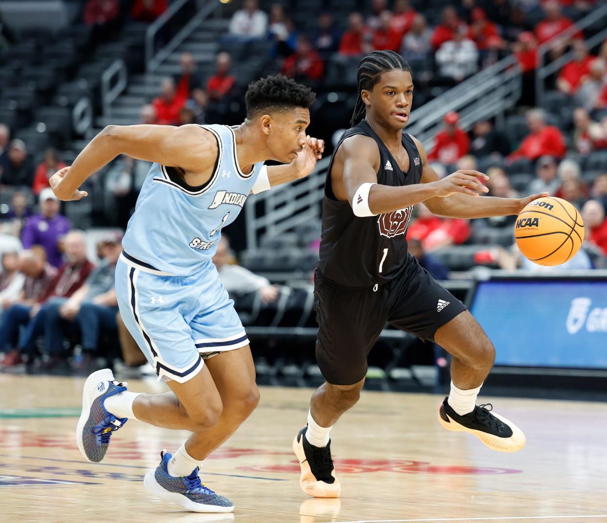 Missouri State junior Alston Mason (1) moves the ball defended by Indiana State junior Julian Larry (1) during a Missouri Valley Conference Tournament game between Missouri State and Indiana State, Friday, March 8, 2024, at Enterprise Center in St. Louis.