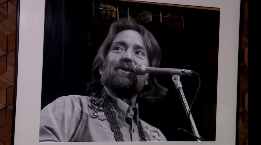 A photo of Willie Nelson performing on the Austin City Limits TV show hangs on a wall inside Austin PBS. (KXAN Photo/Ed Zavala)