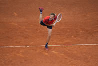 Daniil Medvedev of Russia follows through on a serve to Jiri Lehecka of the Czech Republic during the Mutua Madrid Open tennis tournament in Madrid, Spain, Thursday, May 2, 2024. (AP Photo/Manu Fernandez)