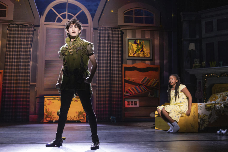 This image released by Bond Theatrical shows Nolan Almeida as Peter Pan, left, and Hawa Kamara as Wendy, during a performance of a new, inclusive stage production of “Peter Pan.” The touring production kicks off in Maryland on Feb. 21 and travels to North Carolina, Ohio, Illinois, Washington, D.C., South Carolina, Florida, Arizona, Nevada, California, Missouri, Texas and Georgia. (Matthew Murphy/Bond Theatrical via AP)