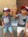 <p>Two of <i>Stranger Things</i>’ littlest fans play with their Eleven souvenirs while rocking Dustin hats. <br><br>(Photo: Yahoo) </p>