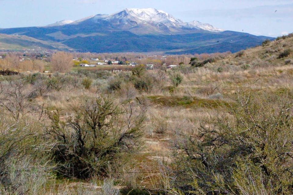 With spring snow, Squaw Butte towers over Emmett. The peak will soon be known by a different name as the U.S. Department of the Interior removes the S-word from 660 geographic features in the United States.