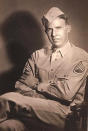 An undated handout image provided by the Kriegshauser family showing Lt. John G. Kriegshauser posing for a photo in Spokane, Washington, USA. On Friday Feb. 22, 2019 the U.S. and the Royal Air Force are set to honor Lt. John G. Kriegshauser and his crew, who decided to crash and die rather than take the chance of hitting a group of playing children on Feb. 22, 1944 when their stricken plane flew over Sheffield in England. (Kriegshauser family via AP)