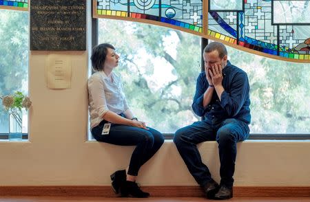 Australian journalist Dean Yates talks with Cath Slarks, spiritual care worker at Ward 17 PTSD facility at Austin Health, located in the Melbourne suburb of Heidelberg in Australia, March 2, 2018. REUTERS/Luis Enrique Ascui