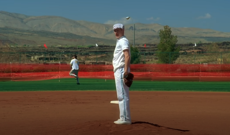 Ryan about to make a pitch on the baseball field from "High School Musical"