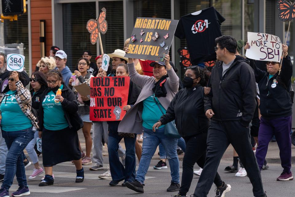 Protesters march in downtown Austin on March 9 to call for a repeal of Senate Bill 4, which would allow state and local law enforcement to arrest and deport people thought to have entered the country illegally.