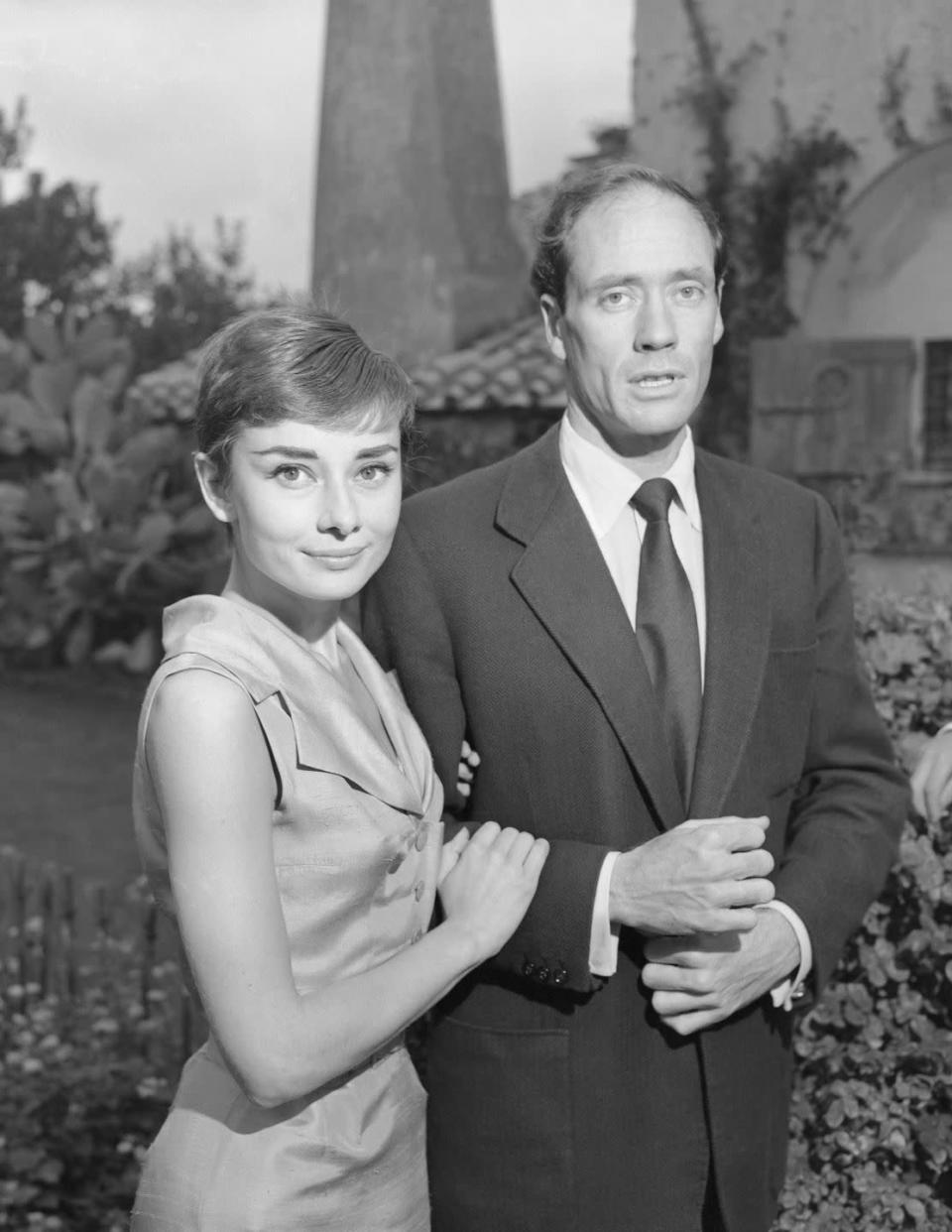 <p>The starlet celebrated her first marriage with a trip to Rome. Here, Hepburn and Ferrer stand in the garden of the Villa Rolli in Albano.</p>