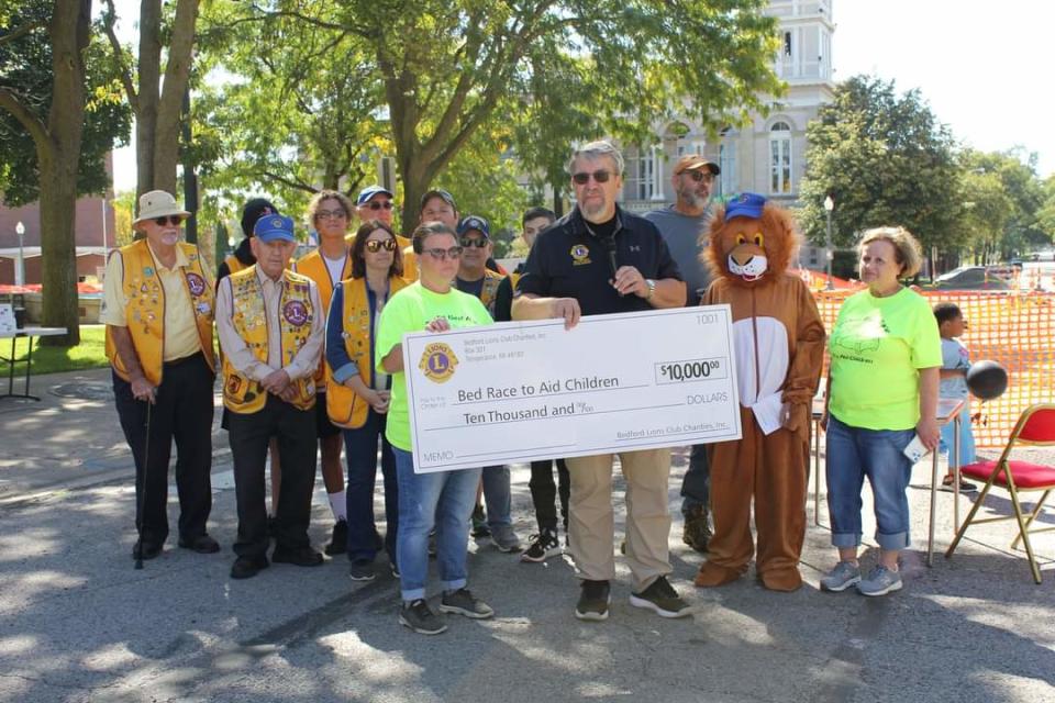 For the 15th annual Bed Race for Children, the Bedford Lions donated $10,000. The club plans to expand its services with a Greater Monroe Lions Club.