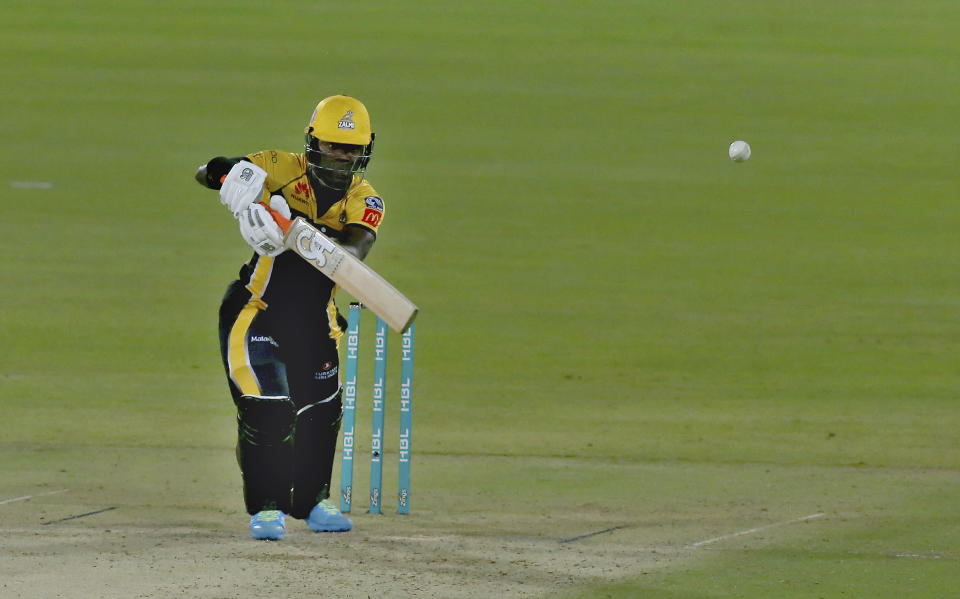 Peshawar Zalmi' Sherfane Rutherford plays a shot during a Pakistan Super League T20 cricket match between Quetta Gladiators and Peshawar Zalmi at the National Stadium, in Karachi, Pakistan, Friday, Feb. 26, 2021. (AP Photo/Fareed Khan)