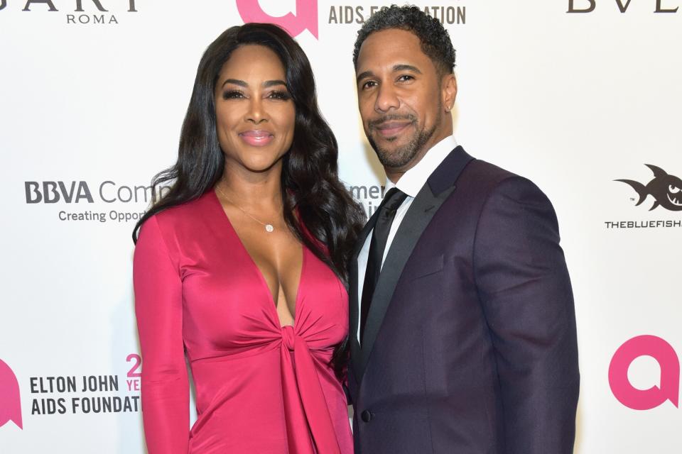 Kenya Moore and Marc Daly attend the 26th annual Elton John AIDS Foundation's Academy Awards Viewing Party at The City of West Hollywood Park on March 4, 2018 in West Hollywood, California.