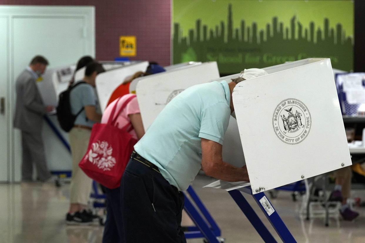 Voters mark their ballots at Frank McCourt High School, in Manhattan, Tuesday, June 22, 2021.