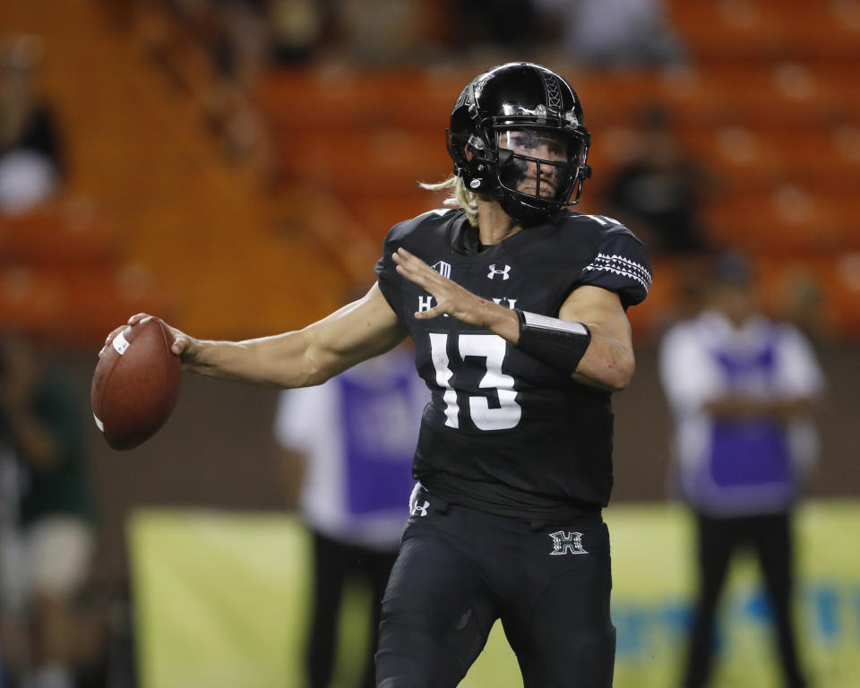 Hawaii quarterback Cole McDonald looks for a receiver during the second quarter against Rice in an NCAA college football game Saturday, Sept. 8, 2018, in Honolulu. (AP Photo/Marco Garcia)