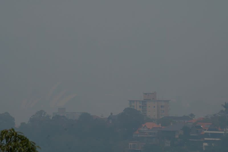 Smoke from bushfires obscures the Sydney Opera House in Sydney