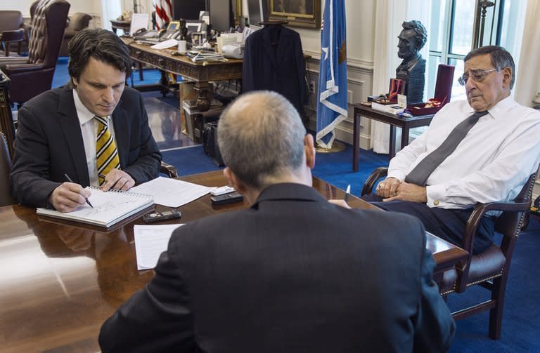 US Secretary of Defense Leon Panetta (right) is interviewed by AFP reporters Jerome Cartillier (left) and Dan De Luce (back to camera) on February 1, 2013 inside Panetta's private office at the Pentagon. The United States will have to keep up an open-ended drone war against Al-Qaeda militants in Pakistan and elsewhere to prevent another terror attack on America, Panetta said